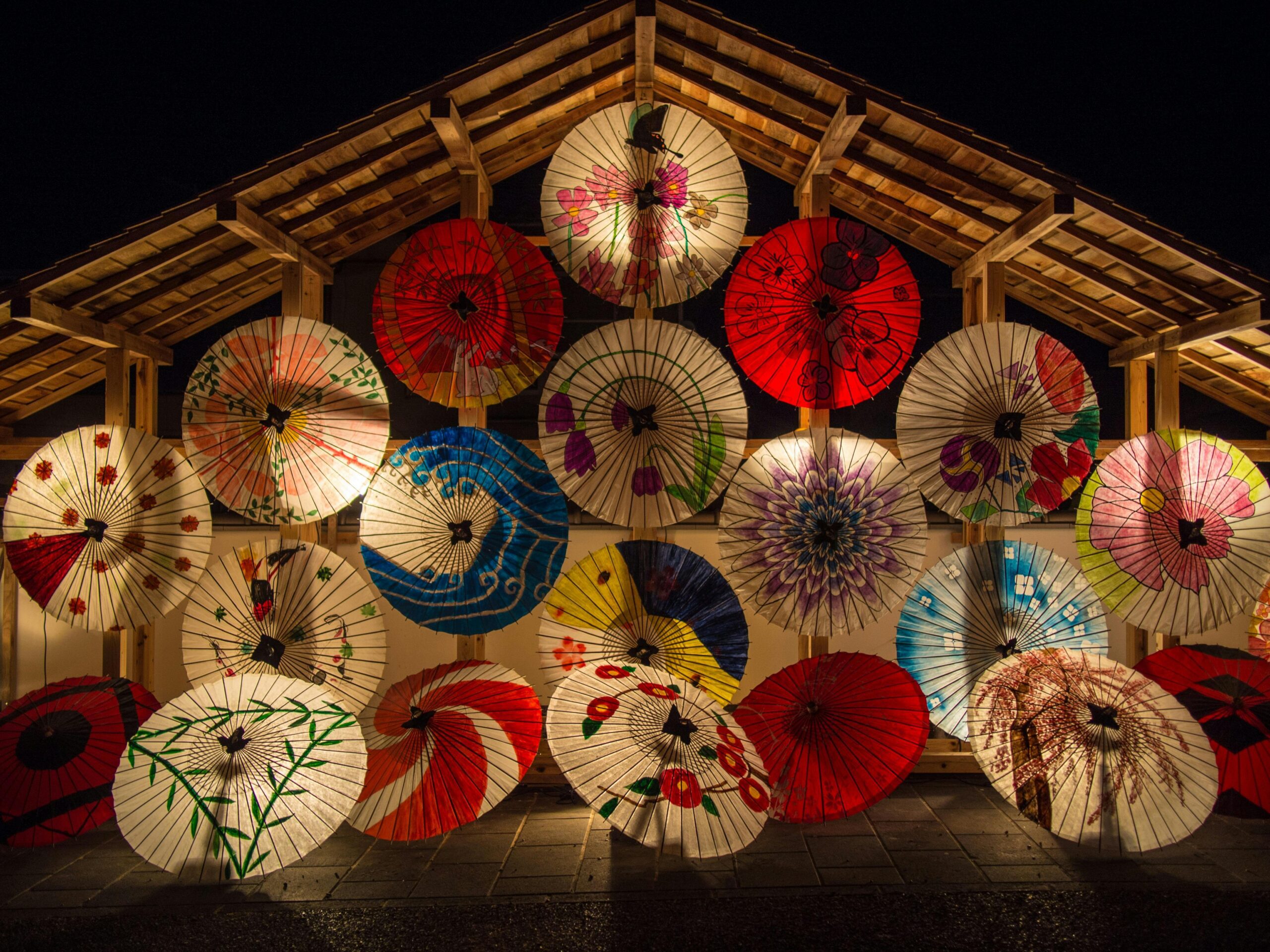 Colorful Japanese umbrellas beautifully arranged at Yamaga, Kumamoto, Japan during nighttime.